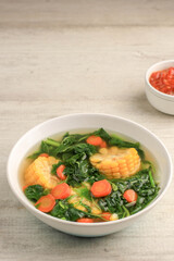 Sayur Bening Bayam is Daily Menu in Indonesian family, made from Spinach, Carrot, and Corn. Spiced with Garlic  and Salt. Served with Various Side Dish like Tofu or Fried Salted Fish and Sambal.