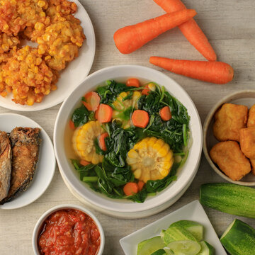 Sayur Bening Bayam is Daily Menu in Indonesian family, made from Spinach, Carrot, and Corn. Spiced with Garlic  and Salt. Served with Various Side Dish like Tofu or Fried Salted Fish and Sambal.