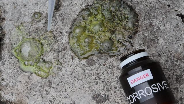 Corrosive chemicals fall on the cement floor