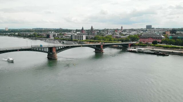 Aerial view towards cars on the Theodor Heuss bridge and the city of  Mainz, Germany - approaching, drone shot