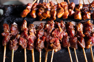 One of the typically Indonesian foods is satay or sate. This food is made from beef or mutton or chicken which is grilled over smoky coals then served with peanut sauce and soy sauce.