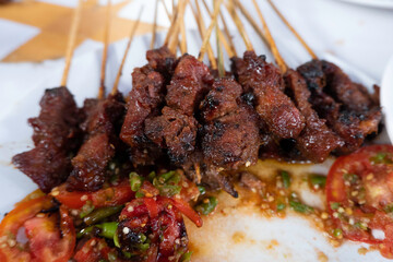 One of the typically Indonesian foods is satay or sate. This food is made from beef or mutton or chicken which is grilled over smoky coals then served with peanut sauce and soy sauce.