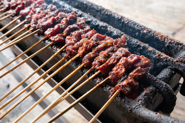 One of the typically Indonesian foods is satay or sate. This food is made from beef or mutton or chicken which is grilled over smoky coals then served with peanut sauce and soy sauce.