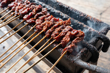 One of the typically Indonesian foods is satay or sate. This food is made from beef or mutton or chicken which is grilled over smoky coals then served with peanut sauce and soy sauce.