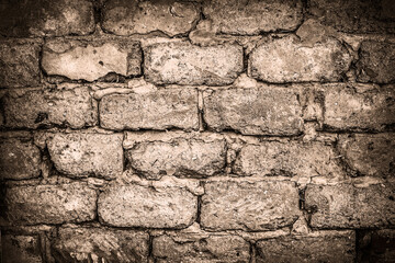 Wall made of big rough concrete blocks as background. Sepia toning.