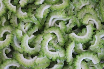 close up of Chopped cut bitter gourd green background