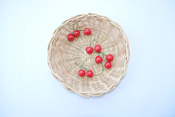 seasonal fruit in basket on white background