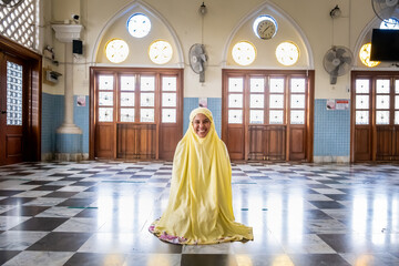 Happy attractive muslim woman travel in Pattani province, posing in mosque. Religion and tourist concept.