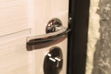 Doorknob and new door during apartment renovation