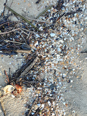 Closeup of Plastic waste on the beach Global problem of Environmental pollution concept with copy space the background in Thailand.