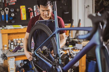 Repair technician bicycles was repaired gear bike shop.