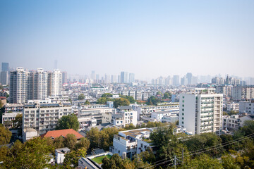 Obraz premium Aerial view of Wuhan city in foggy. Wuhan skyline and Yangtze river with supertall skyscraper under construction in Wuhan Hubei China.