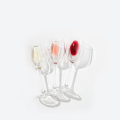 Three wine glasses top view with red, rose and white wine.