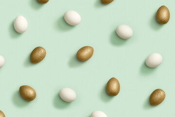 Pattern from Painted Easter eggs white and gold colored on light green paper. Minimal easter concept.