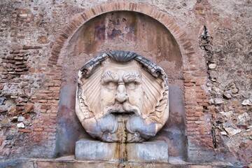 Obraz na płótnie Canvas detail of fountain in rome italy, photo as a background in old italian roman capital city, rome, italy
