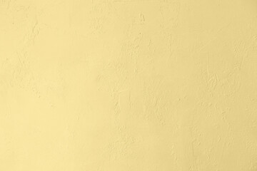 Pastel colored yellow low contrast Concrete textured background with roughness and irregularities. 2021-2022 color trend.