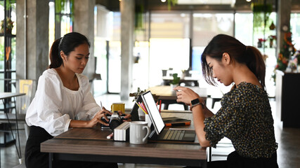 Team of creative designer and photographer working with new startup project planning next steps of work.