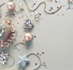 Christmas background . New Year decorations in gold colors frame on silver background. toned. Top view. copy space