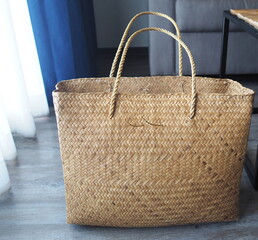 Large handmade bag woven from natural materials. For example, water hyacinths or papyrus are used...