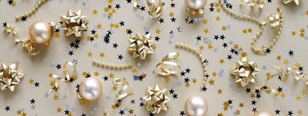 Christmas background banner. New Year decorations in gold colors on gold background. Top view. 