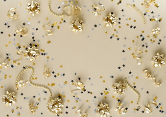 Christmas background . New Year decorations in gold colors frame on gold background. Top view. copy space