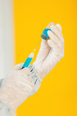 latin Doctor filling syringe with medication, Vaccination and immunization for coronavirus covid pandemic