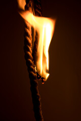 The ropes are burning in the dark.
