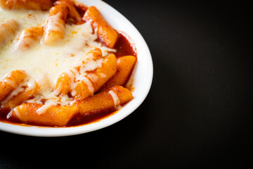 Korean rice cake in spicy Korean sauce with cheese, Cheese Tokpokki, Tteokbokki with Cheese