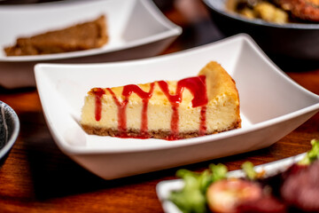 Strawberry Drizzle New York Style Cheesecake Plated Side View