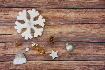 Christmas flat lay with decoration elements on a wooden background