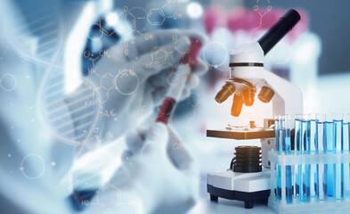 Double exposure of microscope with test tubes and scientist working with blood sample in laboratory