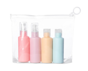 Transparent bag with travel bottles with body care cosmetics on white background