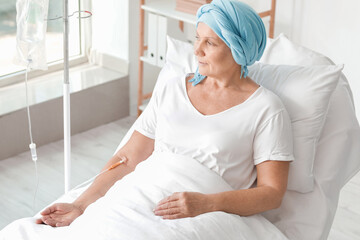 Mature woman undergoing chemical therapy course in clinic
