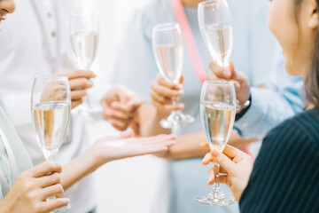 Group Asian business people are having a toast together and chatting at a company party