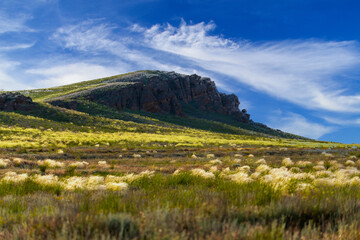 Big Bogdo mountain. Red sandstone outcrops on the slopes sacred mountain in Caspian steppe Bogdo -...