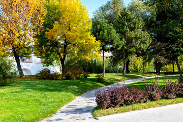 Flowerbeds, Grass Pathway and Ornamental Vase in a Formal Garden