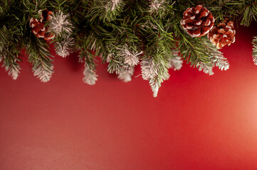 Christmas garland on a red wall background