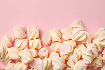 Sweet marshmallow on pink background, space for text