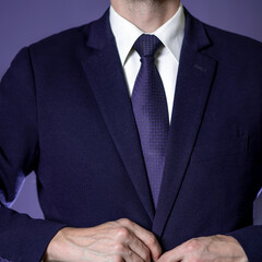 Closeup businessman in suit on black background