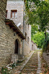 Fototapeta na wymiar Traditional architecture with narrow street and stone buildings a in Vitsa village central Zagori Greece