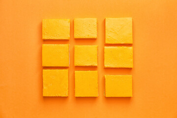 Pieces of tasty pumpkin pie on color background