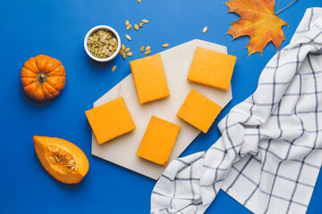 Pieces of tasty pumpkin pie on color background