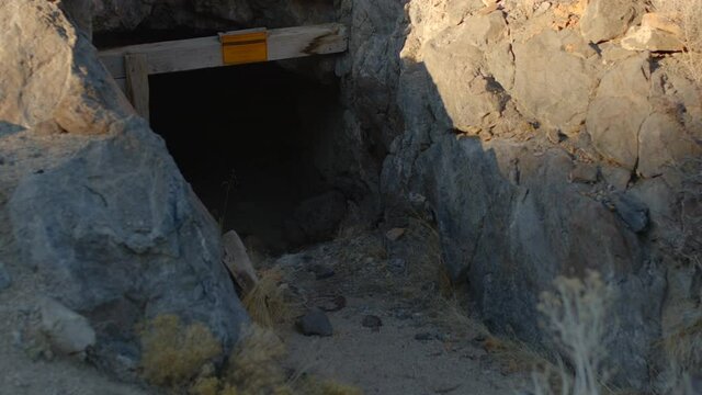 Portal to Abandoned Mine Shaft Surrounded by Rock in the Nevada Desert - Shallow Depth of Field