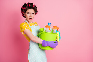 Portrait of her she tired bored disappointed brown-haired housemaid carrying dirty family laundry...