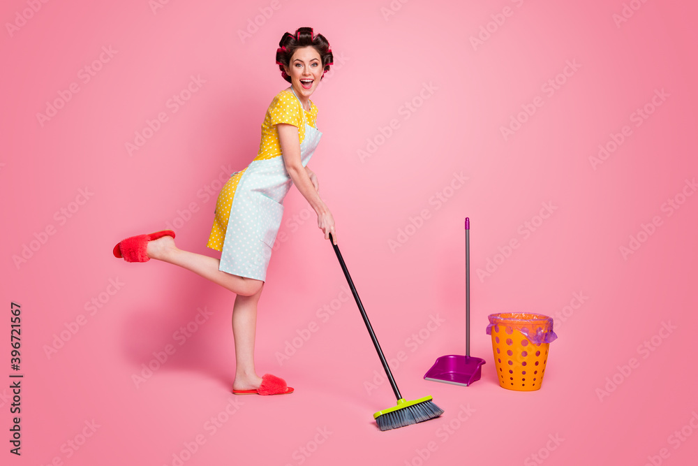 Poster Full length body size view of pretty glad cheerful housemaid maid sweeping posing dancing isolated on pink pastel color background