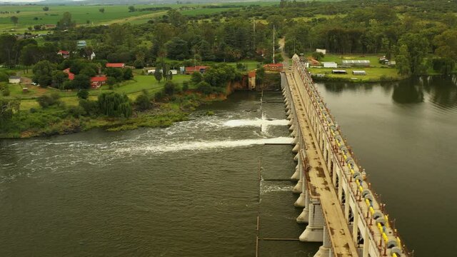 Side view drone footage of Barrage in South Africa, with approaching view , and view from behind the dam wall.