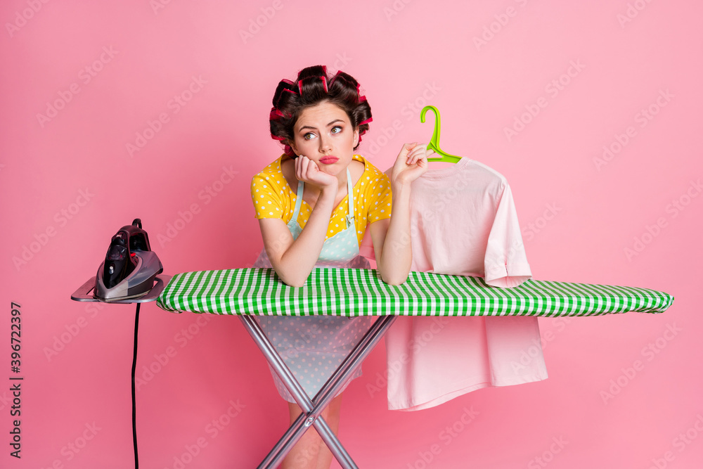 Canvas Prints Photo of sad upset girl iron board hold rack t-shirt look copyspace wear dotted dress isolated on pastel color background