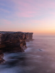 Sunrise view along the rock cliff at Sydney coastline, Australia.