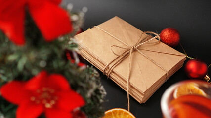 Christmas composition. Xmas festive decoration with letters on black background