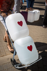 Collecting natural spring water with day zero water crisis with plastic water bottle at Newlands natural spring Cape Town South Africa with water shortage disaster. 